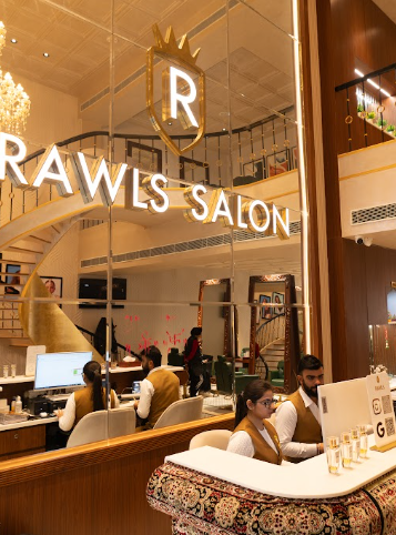 Elegant interior of RAWLS SALON beauty parlour with marigold velvet chairs and gold mirrors